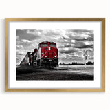 Extra large abstract art print of a train in textured gold and black tones on a framed canvas, ideal for living room decor.