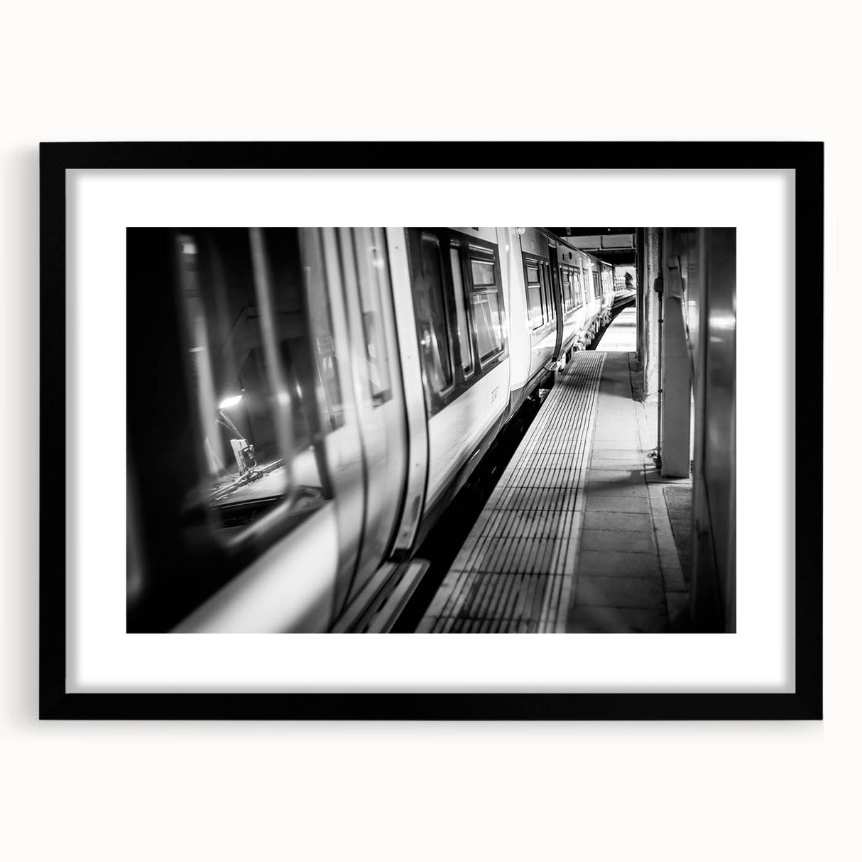 Extra large abstract art print of a colorful, textured train on a black framed canvas, ideal for living room decor.