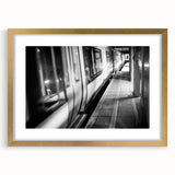 Abstract art print of a stylized train in textured gold and black, framed, ideal for extra large wall art in a living room.