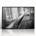 Large abstract wall art featuring a stylized train in muted gray and blue tones on a black framed acrylic.