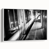 Framed canvas of a vintage poster art featuring a colorful train on a black background, suitable for living room decor.