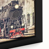 Close-up of a black wall art featuring a colorful, textured train design on a framed canvas, ideal for living room decor.