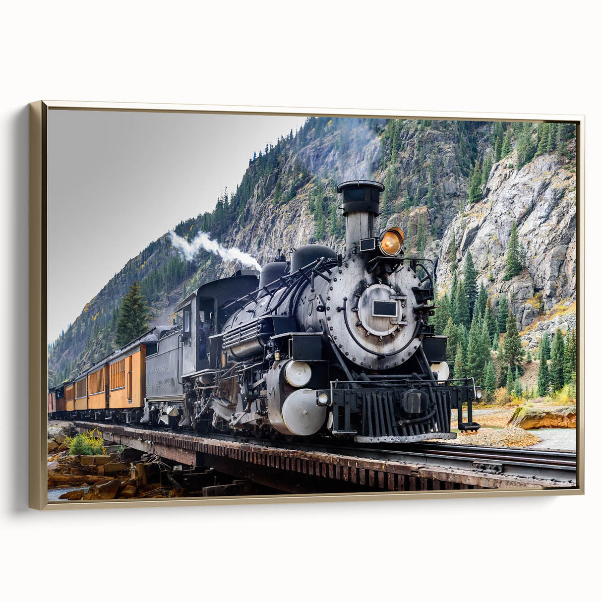 Framed canvas featuring a vintage-style train landscape in black and gold tones, suited for bedroom decor.