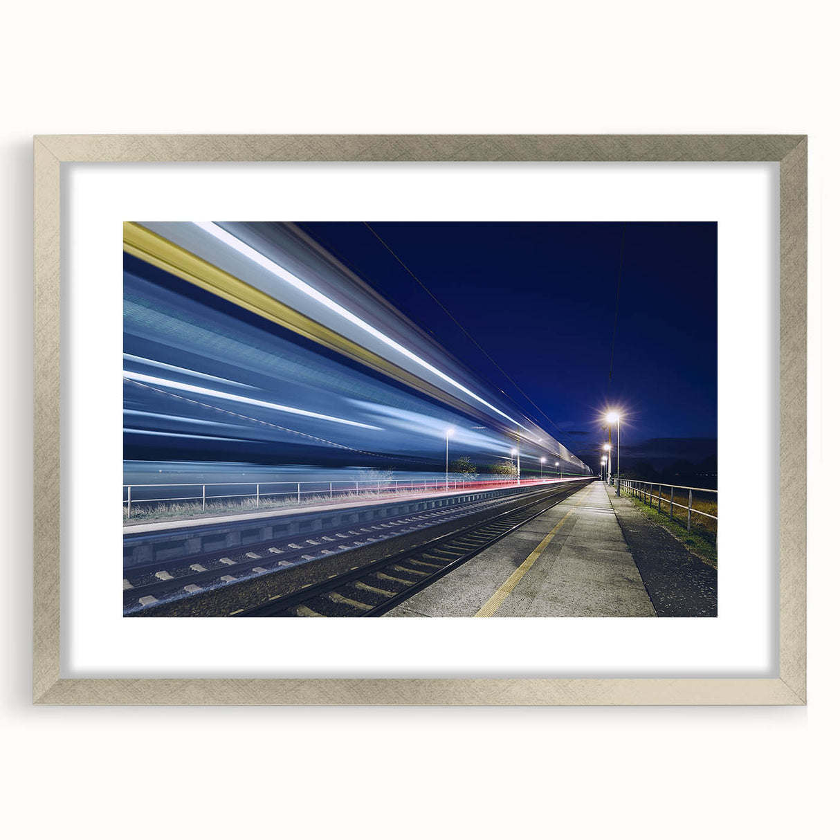 Textured abstract art print featuring a stylized train in muted grays and blues, framed in silver, ideal for bedroom decor.