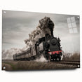 Side view of a train depicted in large abstract wall art on acrylic glass, featuring cool gray and metallic tones.