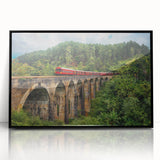 Large abstract wall art depicting a train in muted gray and blue tones, framed in black acrylic.