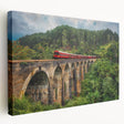 Large art depicting a vintage train in muted earth tones on a stretched canvas, ideal for kitchen wall decor.