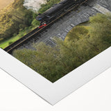 Art deco poster of a streamlined train in silver and blue tones on rolled canvas, suitable for dining room wall art.