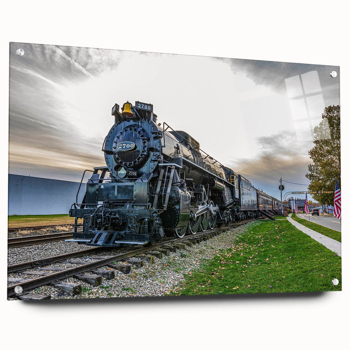 Side view of a train in motion on acrylic glass, featuring gray and blue tones, suitable for modern dining room decor.