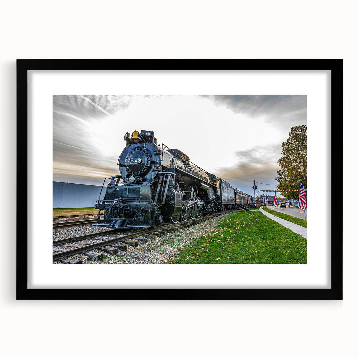 Extra large abstract art print of a colorful, textured train on a black framed canvas, ideal for living room decor.