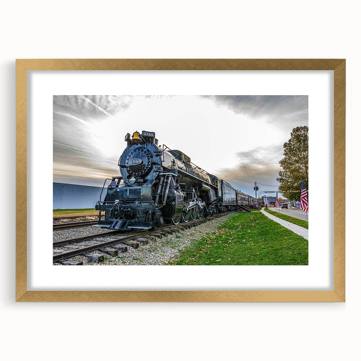 Extra large abstract art print of a train, featuring textured gold and black tones on a framed canvas.