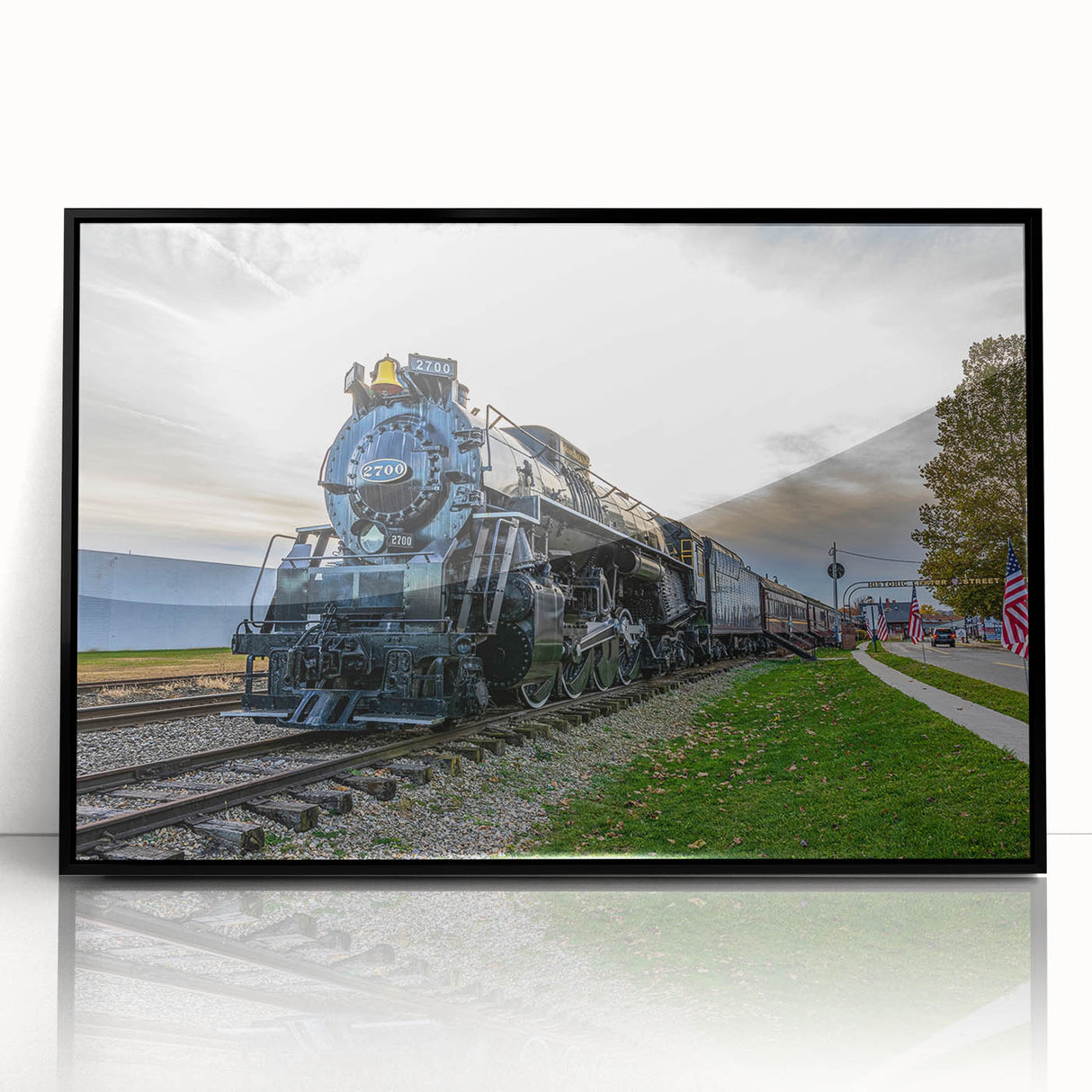 Large abstract wall art of a stylized train in black and gray tones on a framed acrylic, ideal for modern office decor.