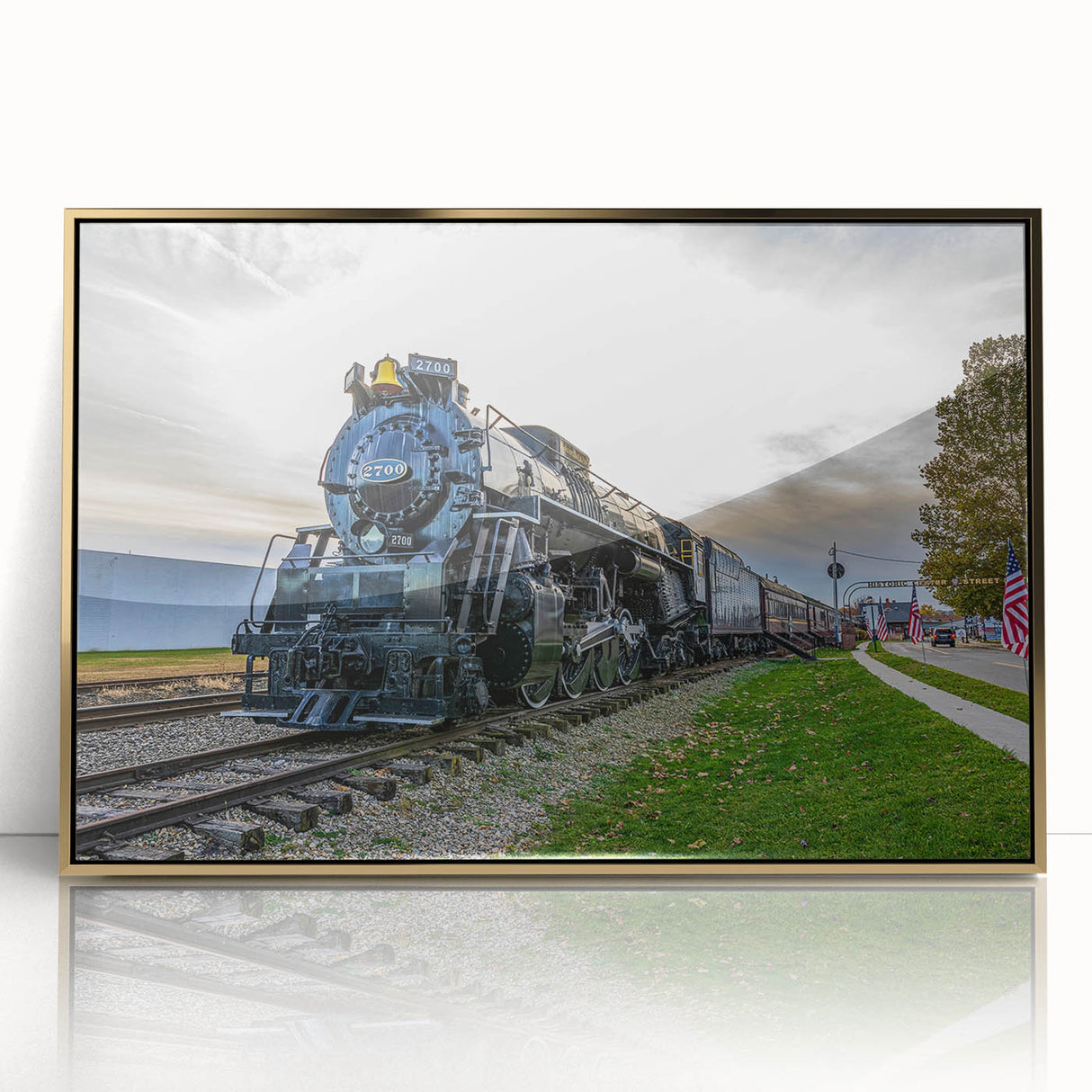 Mid-century modernist train illustration in bold colors on a gold-framed acrylic, ideal for nursery wall art.