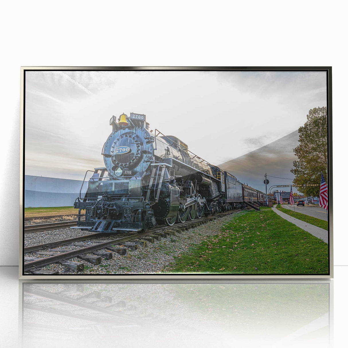 Mid-century modernist train art in muted blues and grays, acrylic print framed in silver, suitable for nursery wall art.