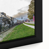 Framed canvas featuring a close-up of a black train with colorful, textured details.