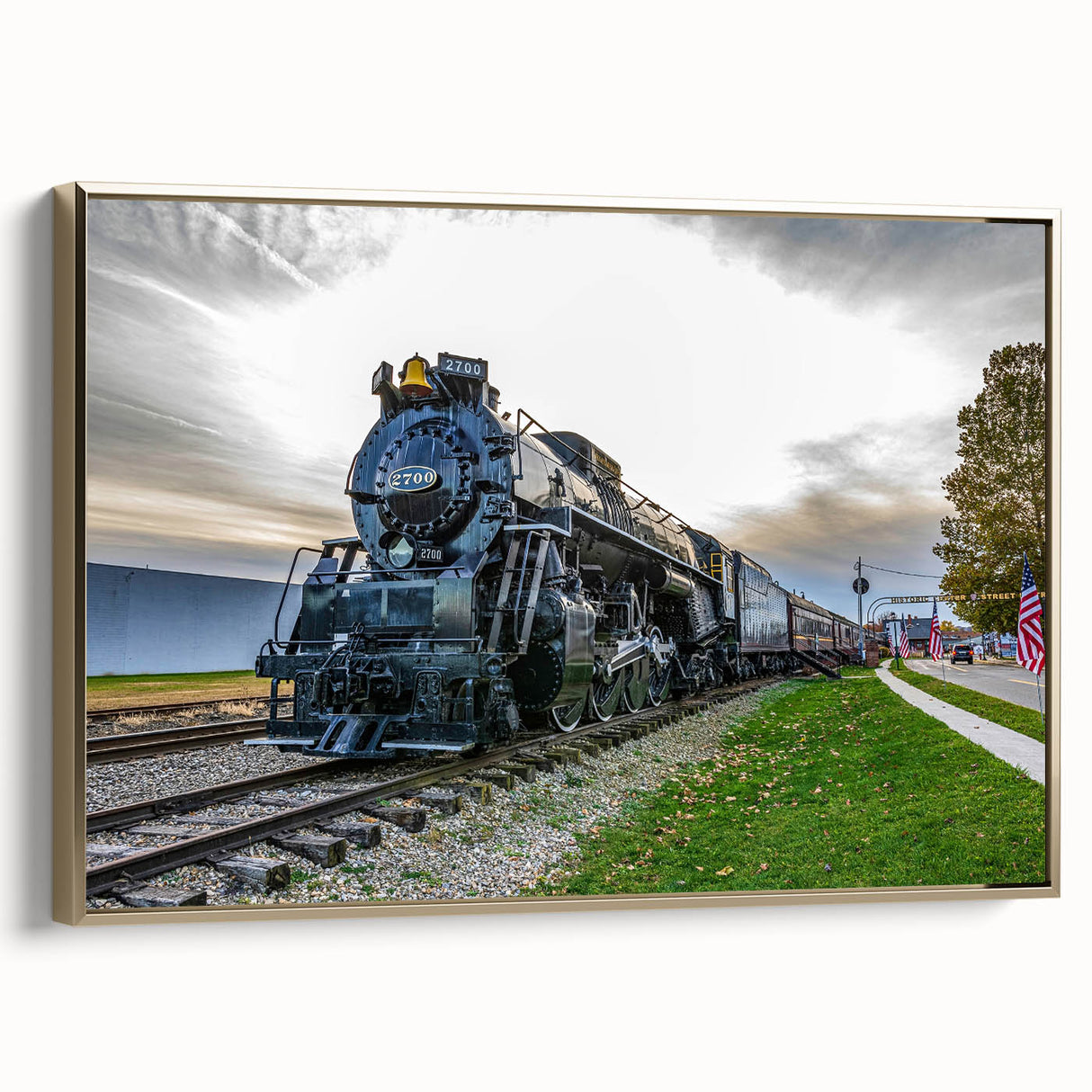 Framed canvas featuring a vintage-style black train landscape, ideal for bedroom wall art.