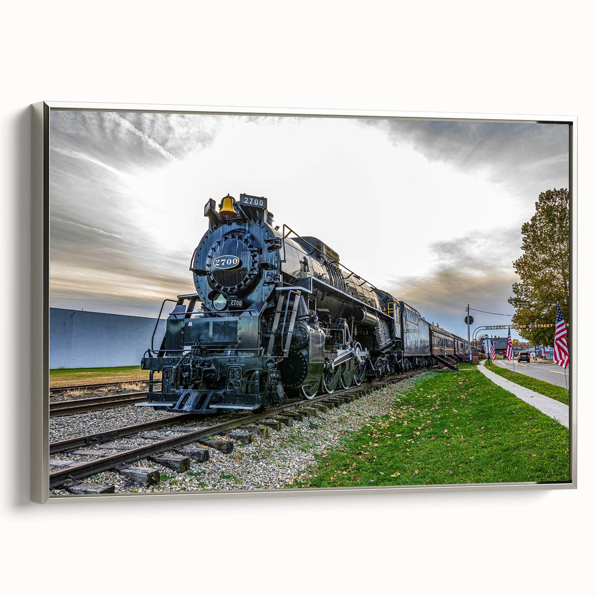 Framed canvas of a vintage train in motion, featuring a landscape background in muted earth tones, ideal for office decor.