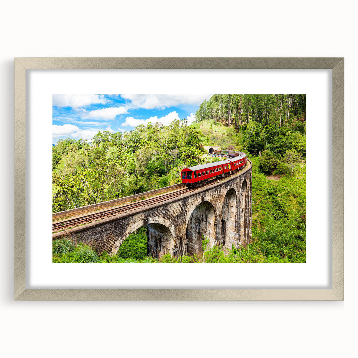 Textured art print of an abstract train in muted grays and blues on a silver-framed mat, ideal for bedroom decor.