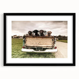 Extra large abstract art print featuring colorful, textured trucks, framed in black, ideal for living room decor.