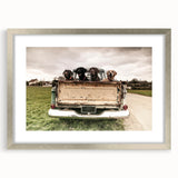 Textured art print featuring abstract trucks in muted gray and blue tones on a framed poster, suitable for bedroom decor.