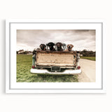 Abstract art print of colorful trucks on a white framed poster, suitable for dining or bedroom decor.