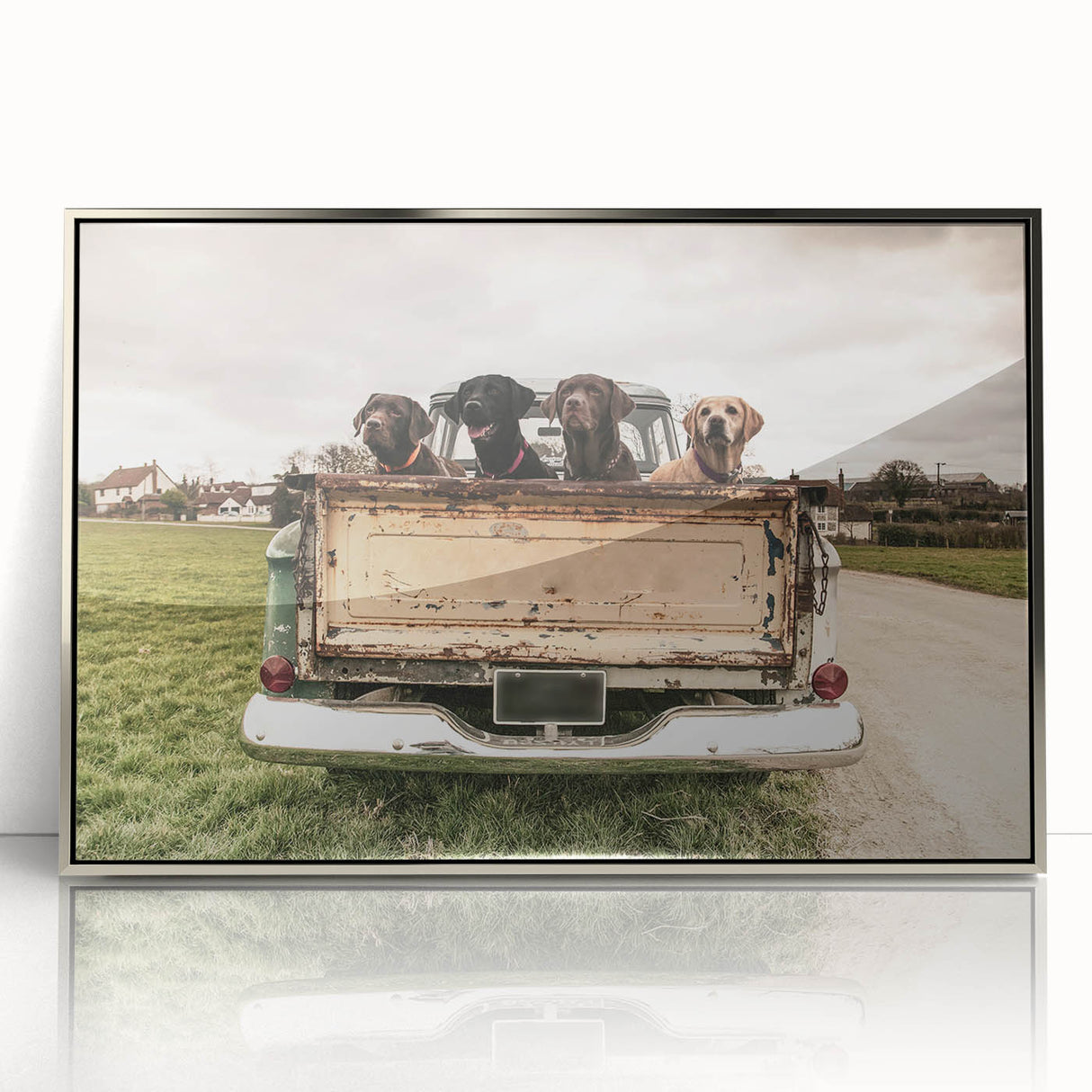 Mid-century modernist art featuring a series of stylized trucks in monochrome shades, framed in silver acrylic.