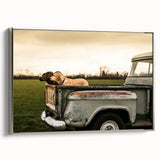 Framed canvas depicting a vintage black truck on a colorful abstract landscape, ideal for a modern living room.