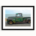Extra large abstract art print of colorful, textured trucks on a black framed canvas, suitable for living room decor.