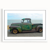 Abstract art print of colorful trucks in a dynamic composition on a white framed mat, ideal for dining room decor.