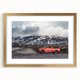 Extra large abstract art print of colorful trucks on a textured canvas, framed in gold, suitable for living room decor.