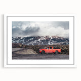 Abstract art print of colorful trucks on white framed canvas, suitable for bedroom or dining room decor.