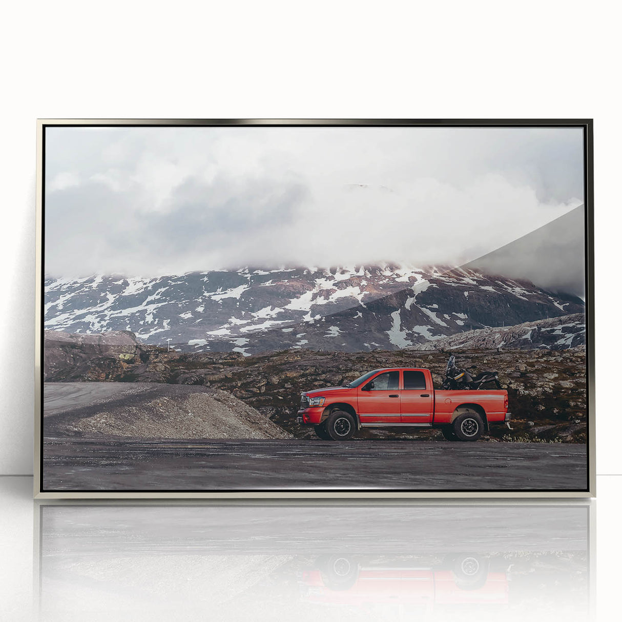 Mid-century modernist art depicting trucks in muted colors on a silver-framed acrylic print, suitable for nursery wall art.
