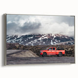 Framed canvas featuring a vintage-style black truck on a colorful, abstract landscape.