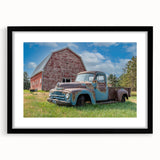 Extra large abstract art print of colorful, textured trucks on a black framed canvas, ideal for living room decor.