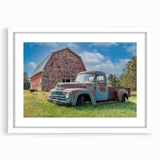 Abstract art print of colorful trucks in a minimalist style on a white framed poster, suitable for dining room decor.