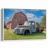 Framed canvas of a vintage poster featuring a side view of colorful trucks on a black background.