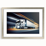 Textured art print of abstract trucks in gray and black, framed in silver, ideal for bedroom decor.