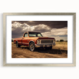 Textured abstract art print featuring a collection of stylized trucks in muted gray and blue tones, framed in silver.
