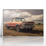 Framed acrylic print of art deco-style trucks in muted colors, suitable for modern nursery wall decor.