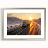 Textured art print of abstract trucks in silver and gray tones, framed with a silver mat, suitable for bedroom decor.